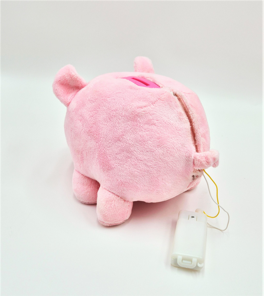 Piggy, das flauschige grunzende Sparschwein